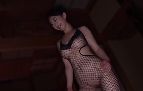 Big-busted Japanese girl apropos fishnet contraption pleasuring her man